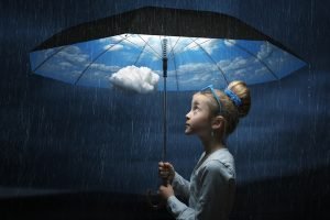 Little girl holding the magic umbrella Stock Photo 300x200 The good weather umbrella